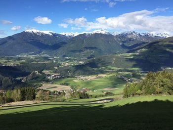 Scenic view of landscape and mountains against sky