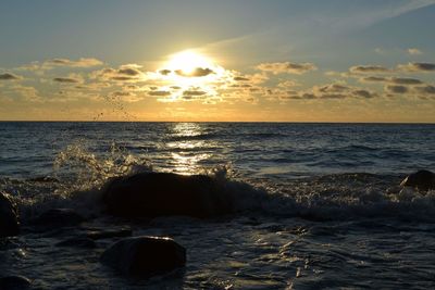 Scenic view of sea against sky during sunset