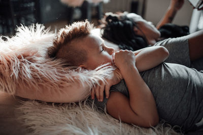 Young woman sleeping on bed at home