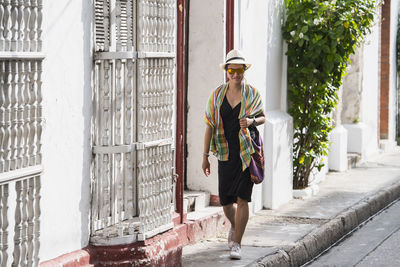 Woman exploring the streets of cartagena in columbia