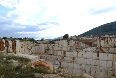 View of old ruins against cloudy sky