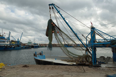 Boats moored at harbor