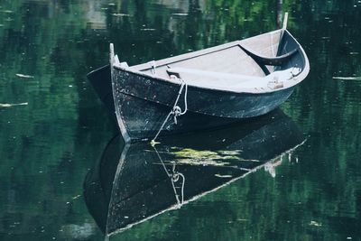 Boat moored in lake