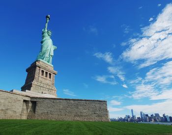 Low angle view of statue against sky