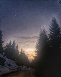 Scenic view of landscape against sky at night during winter