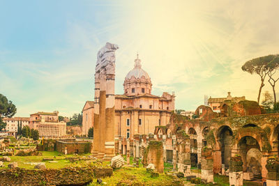 Old ruins at roman forum against sky