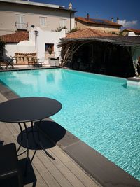 View of swimming pool by building