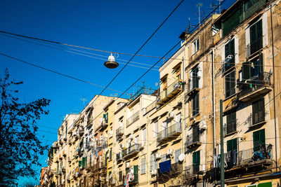 Low angle view of residential building against clear sky