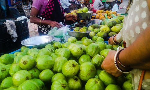 Close-up of people for sale at market stall