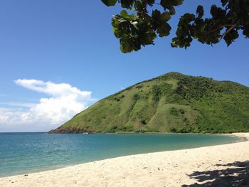 Scenic view of sea against blue sky