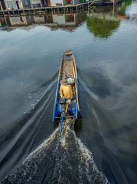 High angle view of man on boat in water