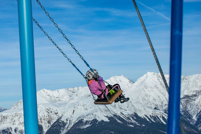 Mountain swing in winter at an altitude of 2200 meters