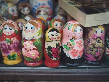 Close-up of multi colored dolls for sale in market