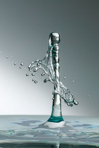 Close-up of water splashing on glass