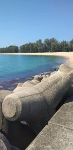 Scenic view of lake against clear blue sky