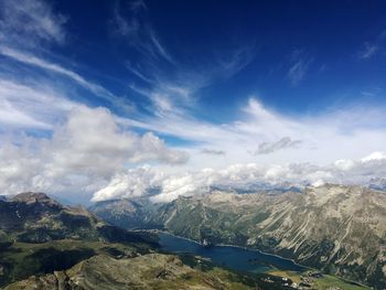 Scenic view of mountains against blue sky