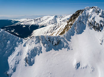 Snow covered mountain against sky