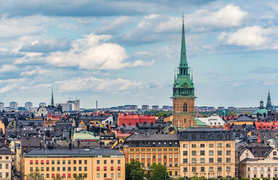 Buildings in city against sky