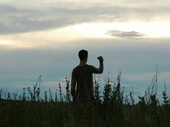 Scenic view of landscape against sky at sunset