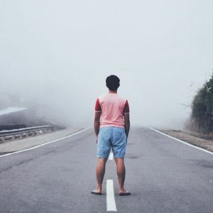 Man walking on road