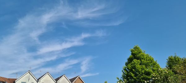 Low angle view of building against blue sky