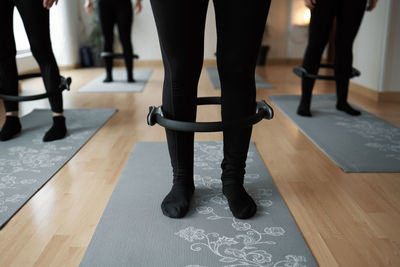 Group of women practicing pilates exercises in class