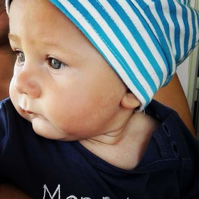 CLOSE-UP OF BOY WITH TATTOO