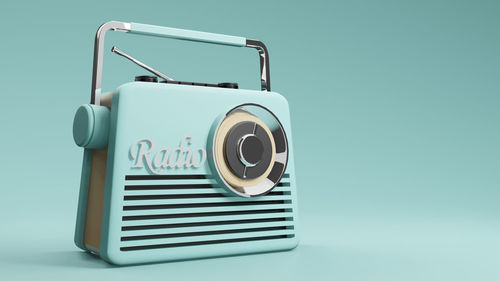 Close-up of telephone booth against blue background