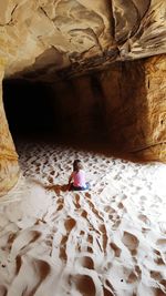 Woman standing on rock formation