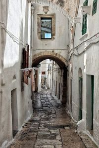 Narrow alley amidst old buildings in town