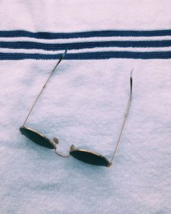 High angle view of sunglasses on textile