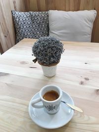 High angle view of coffee cup on table