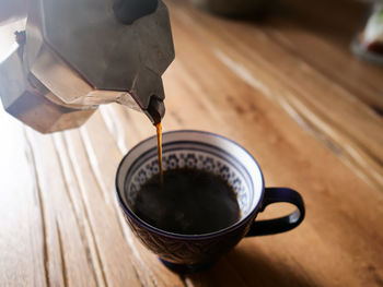 High angle view of coffee cup on table