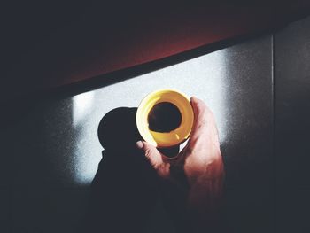 Person holding coffee cup