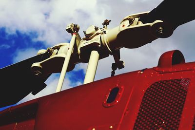 Low angle view of hand against sky