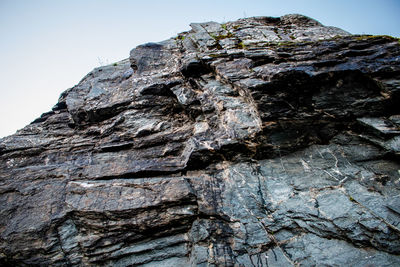 Low angle view of rock formation against sky