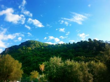 Scenic view of mountains against cloudy sky