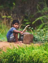 Portrait of boy wearing sunglasses on land