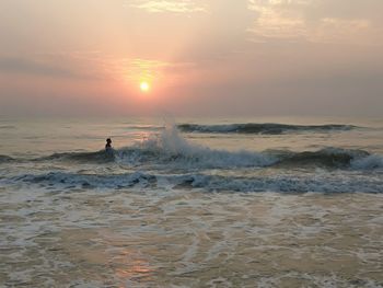 Scenic view of sea against sky during sunset