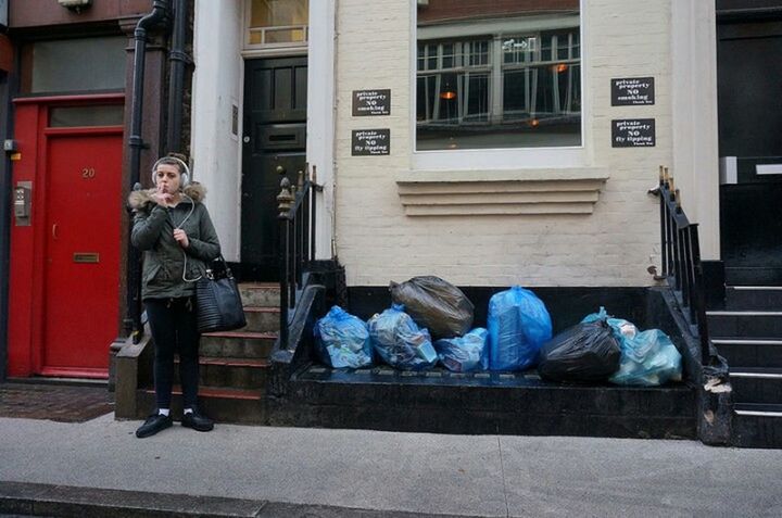 full length, building exterior, one person, architecture, outdoors, built structure, day, real people, one man only, sitting, city, adults only, adult, people, only men