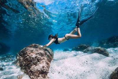 Woman swimming in sea