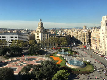 High angle view of buildings and trees against sky