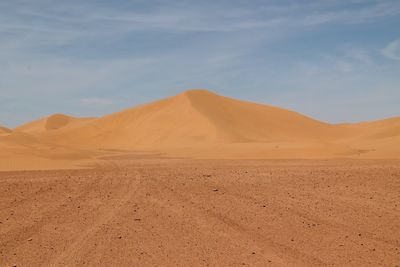 Scenic view of sahara desert against sky