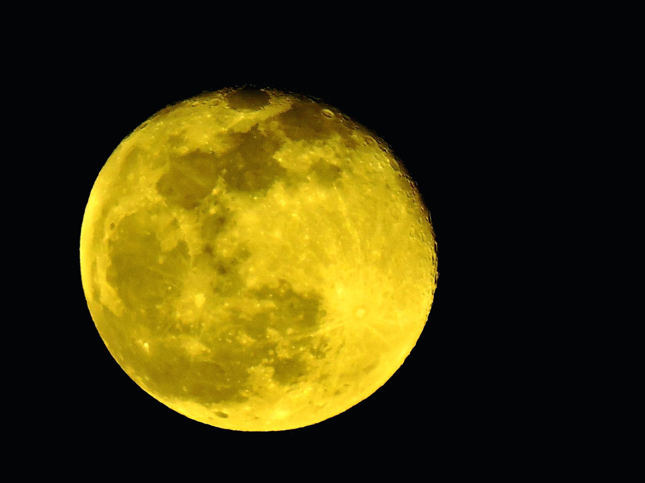 CLOSE-UP OF MOON AGAINST DARK SKY