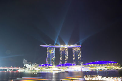 Illuminated buildings at waterfront