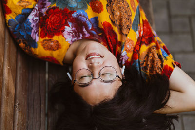 Asian woman enjoying the tranquility of leisure time in nature, listening to music