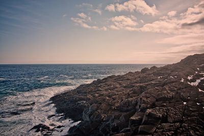 Scenic view of sea against sky at sunset