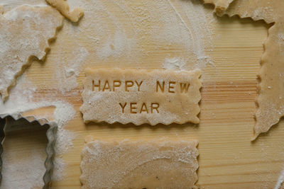 Happy new year written on a cookie