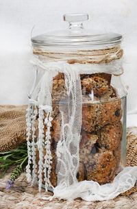 Glass jar of homemade health rusks on rustic table