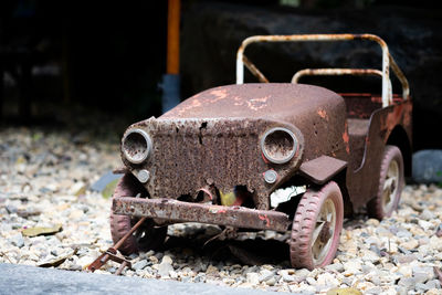 Abandoned toy car on field